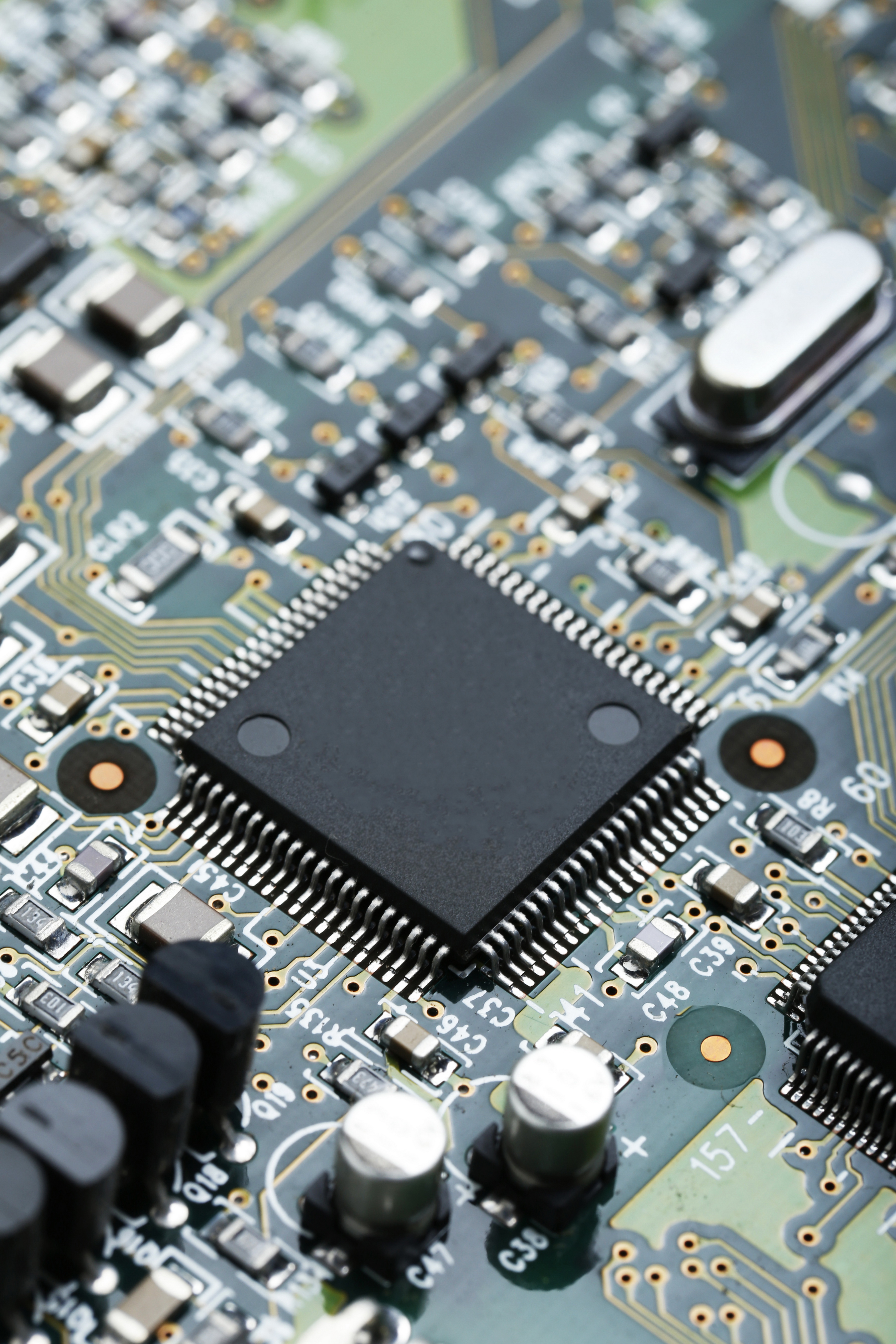 Custom PCB with an ESP32 microcontroller module and gold traces